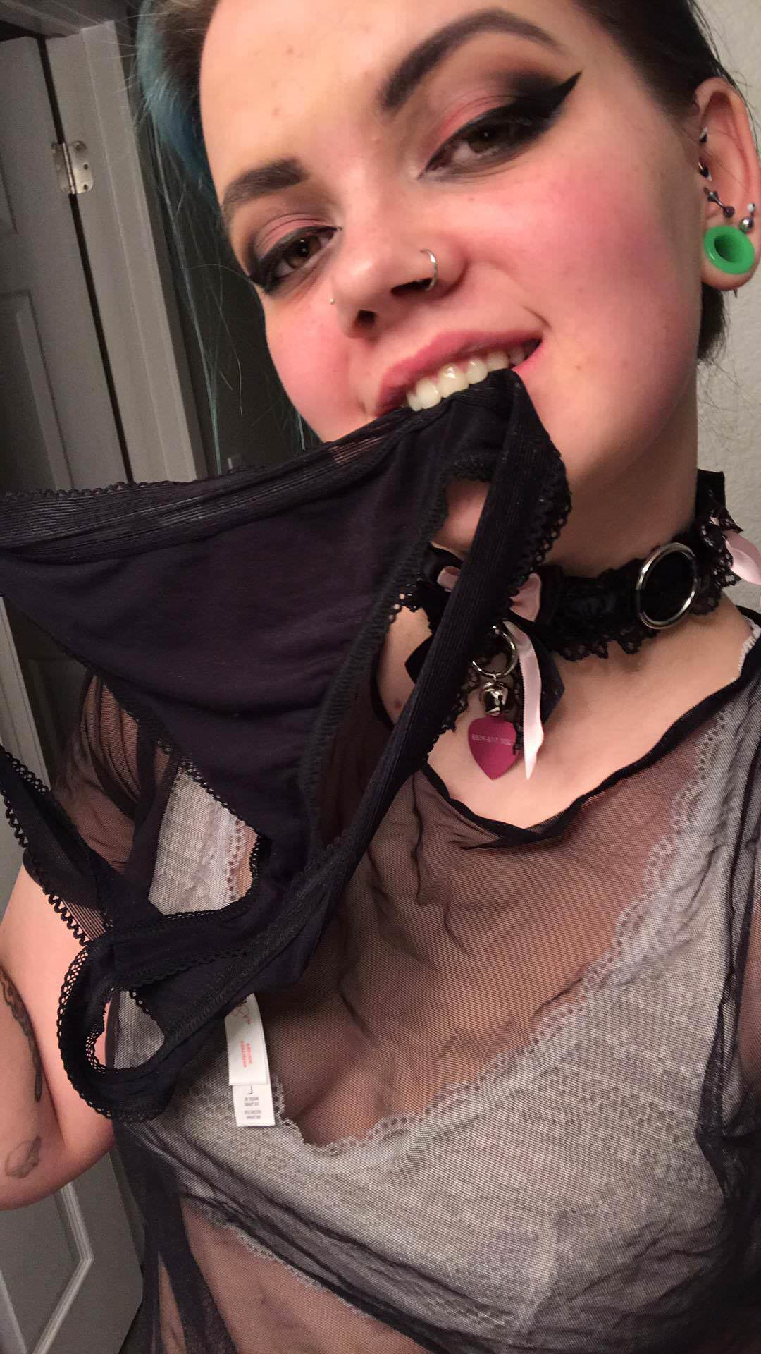 Tiny Tits Teen with Red Hot Lipstick Poses with Her Hands Above her Head.